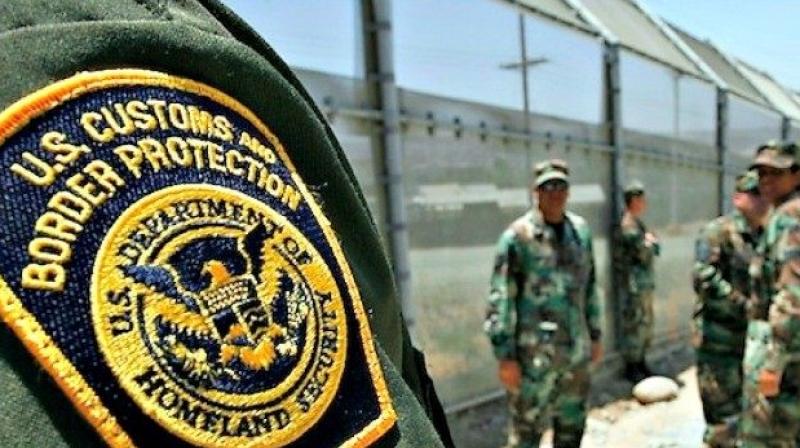 A family attorney says agents let her through a checkpoint separating the cities, but followed her and a cousin to the hospital, and refused to release her after the surgery. (Photo: AP)