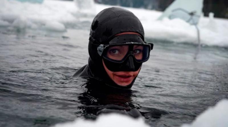 Johanna Nordblad, 42, Finnish freediver looks up from the water during a Ice-freediving training session on February 28, 2017, in Somero. (Photo: AFP)