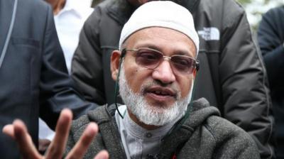 Farid, who uses a wheelchair after an earlier accident, was talking to a friend and was delayed from joining worshippers at his usual spot at the front of the mosque, instead praying in a small side room. (Photo: AFP)