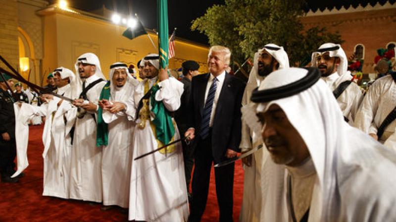 On his first foreign tour as the US President, Donald Trump joined in a traditional sword dance welcome ceremony ahead of a banquet at the Murabba Palace in Saudi Arabia. (Photo: AP)