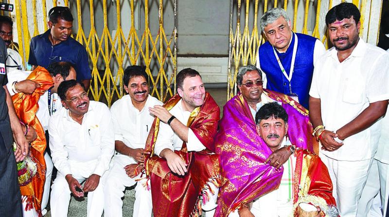 Congress president Rahul Gandhi (centre), Karnataka chief minister Siddaramaiah and others at Kurudumale Ganesha temple during an election campaign in Kolar. (Photo: PTI) Congress president Rahul Gandhi (centre), Karnataka chief minister Siddaramaiah and others at Kurudumale Ganesha temple during an election campaign in Kolar. (Photo: PTI)