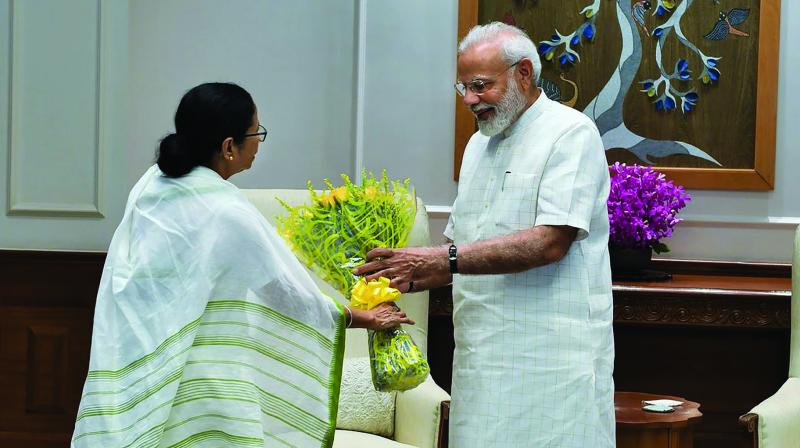 Prime Minister Narendra Modi is greeted by West Bengal chief minister Mamata Banerjee during a meeting in New Delhi on Wednesday. (Photo: PTI)