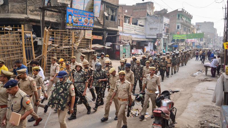 olice conduct flag march in a locality, a day after clashes broke out between two groups over market shutdown, in Kanpur, Saturday, June 4, 2022. (PTI) olice conduct flag march in a locality, a day after clashes broke out between two groups over market shutdown, in Kanpur, Saturday, June 4, 2022. (PTI)