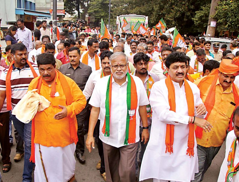 BJPâ€™s Gopalaiah accompanied by Minister Suresh Kumar and party workers go in a procession to file his papers for Mahalakshmi Layout seat.