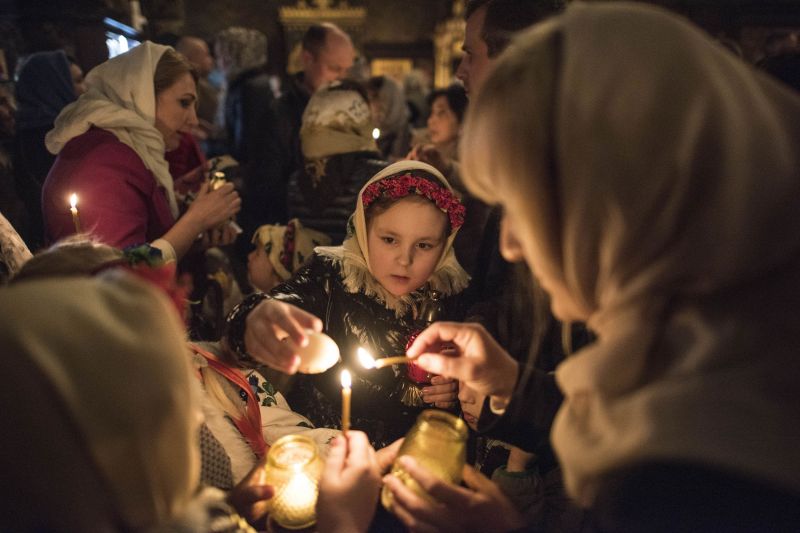 A Russian Orthodox priest blesses cakes and coloured eggs during an Orthodox Easter ceremony in Saint Petersburg on April 7, 2018, on the eve of the Orthodox Easter. Orthodox Ukrainians flock to churches around the country this week to celebrate Easter, the country's foremost religious celebration. (Photo: AFP) A Russian Orthodox priest blesses cakes and coloured eggs during an Orthodox Easter ceremony in Saint Petersburg on April 7, 2018, on the eve of the Orthodox Easter. Orthodox Ukrainians flock to churches around the country this week to celebrate Easter, the country's foremost religious celebration. (Photo: AFP)
