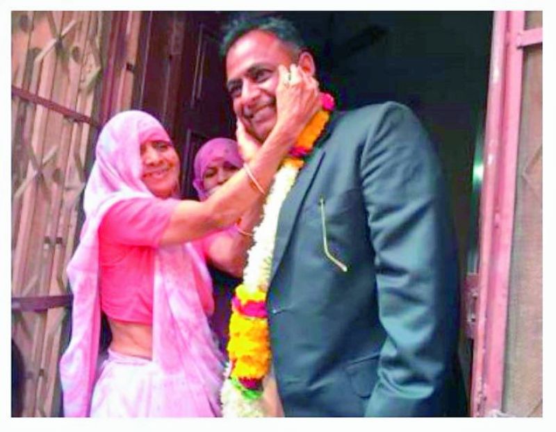 Well done son: Aichuki Devi, mother of Poonam Chand Solanki greets him on his return from the court after winning the Asaram case. 