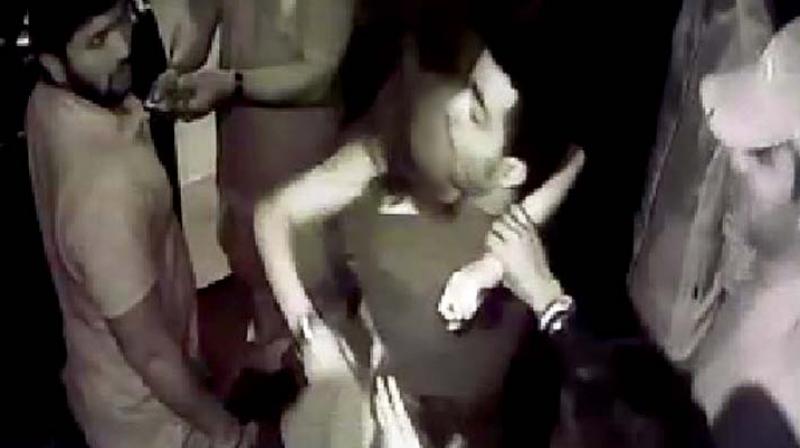 A CCTV grab shows the victim being taken out of the pub. A CCTV grab shows the victim being taken out of the pub.