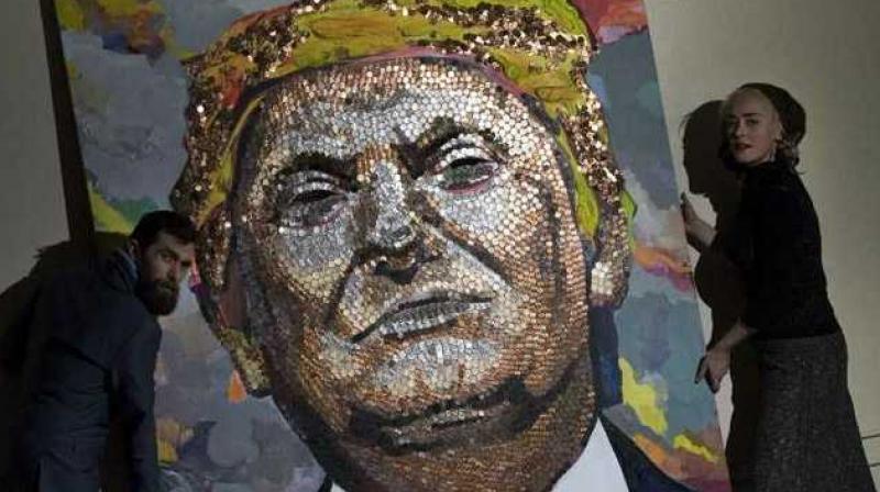 Image result for Trump version, called 'Face of Money' plays in the light revealing different expressions