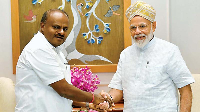Chief Minister H.D. Kumaraswamy with PM Narendra Modi in New Delhi on Saturday. (Photo: KPN) Chief Minister H.D. Kumaraswamy with PM Narendra Modi in New Delhi on Saturday. (Photo: KPN)