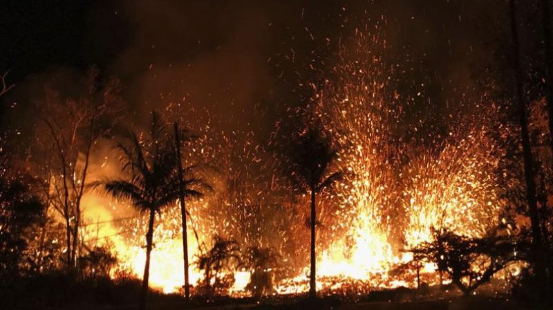 In this photo, a new fissure erupts in Leilani Estates in Pahoa, Hawaii. Hawaii’s erupting Kilauea volcano has destroyed homes and forced the evacuations of more than a thousand people. (U.S. Geological Survey via AP) In this photo, a new fissure erupts in Leilani Estates in Pahoa, Hawaii. Hawaii’s erupting Kilauea volcano has destroyed homes and forced the evacuations of more than a thousand people. (U.S. Geological Survey via AP)