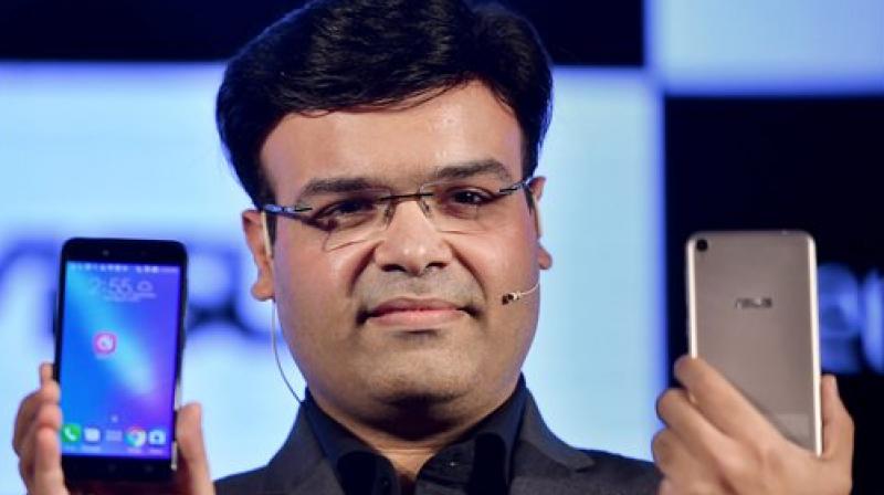 Director Mobile Product, Asus India, Dinesh Sharma showing ASUS Zenfone Live mobile (Photo: PTI)handsets. Director Mobile Product, Asus India, Dinesh Sharma showing ASUS Zenfone Live mobile (Photo: PTI)handsets.