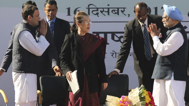Newly-elected president of the Congress party Rahul Gandhi, left, greets former prime minister Manmohan Singh, right, as former party president Sonia Gandhi watches during a function at the party headquarters in New Delhi. (Photo: AP) Newly-elected president of the Congress party Rahul Gandhi, left, greets former prime minister Manmohan Singh, right, as former party president Sonia Gandhi watches during a function at the party headquarters in New Delhi. (Photo: AP)