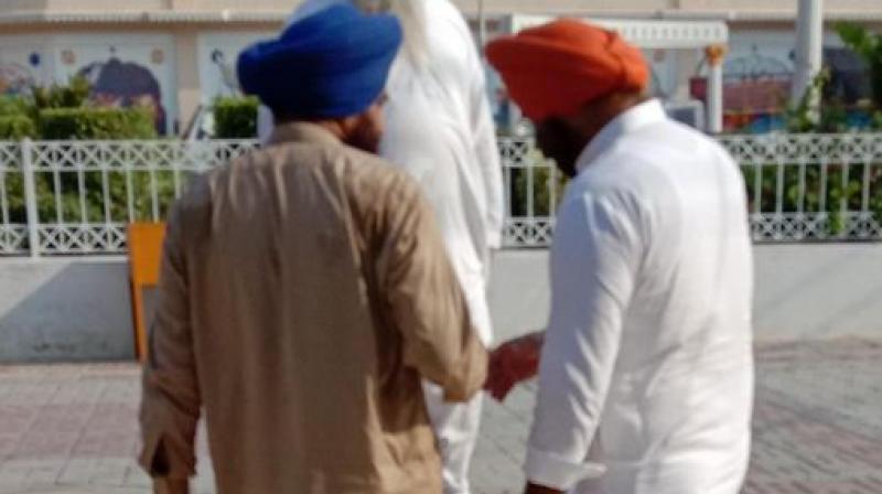 'This is a forced picture which gunman of Gopal Singh Chawla clicked! I refuse to meet people like him who are anti-India and act as hate peddlers!' Sirsa said. (Photo: Twitter I mssirsa) 'This is a forced picture which gunman of Gopal Singh Chawla clicked! I refuse to meet people like him who are anti-India and act as hate peddlers!' Sirsa said. (Photo: Twitter I mssirsa)