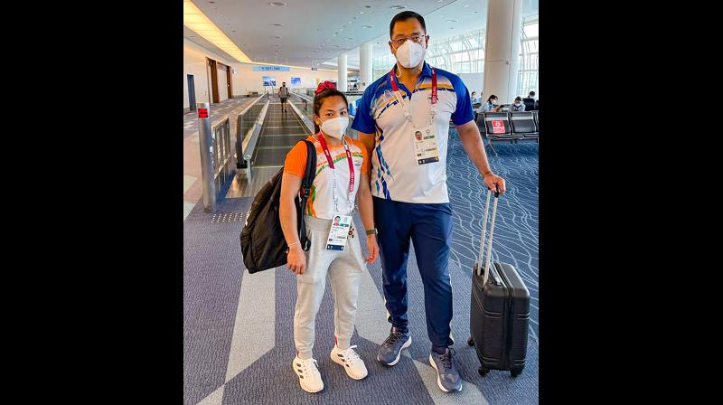 Olympic silver medalist Mirabai Chanu before her flight to India, in Tokyo. -- PTI Olympic silver medalist Mirabai Chanu before her flight to India, in Tokyo. -- PTI