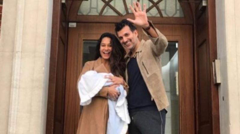 Lisa Haydon and Dino Lalvani with their baby boy Zack in London (Instagram: lisahaydon). Lisa Haydon and Dino Lalvani with their baby boy Zack in London (Instagram: lisahaydon).