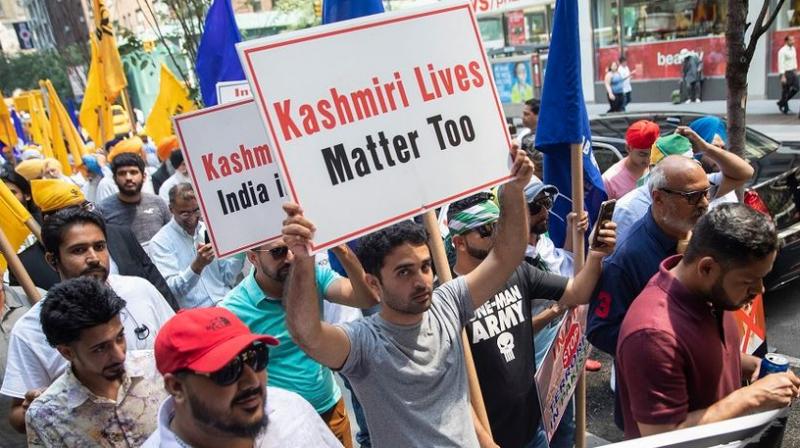 The anti-India protest, organised by Pakistani groups and Sikh and Kashmiri separatist outfits, was demarcated with metal barriers from a pro-India demonstration outside India House, during which placard-waving crowds disrupted the flow of traffic and chanted slogans. (Photo: AP) The anti-India protest, organised by Pakistani groups and Sikh and Kashmiri separatist outfits, was demarcated with metal barriers from a pro-India demonstration outside India House, during which placard-waving crowds disrupted the flow of traffic and chanted slogans. (Photo: AP)