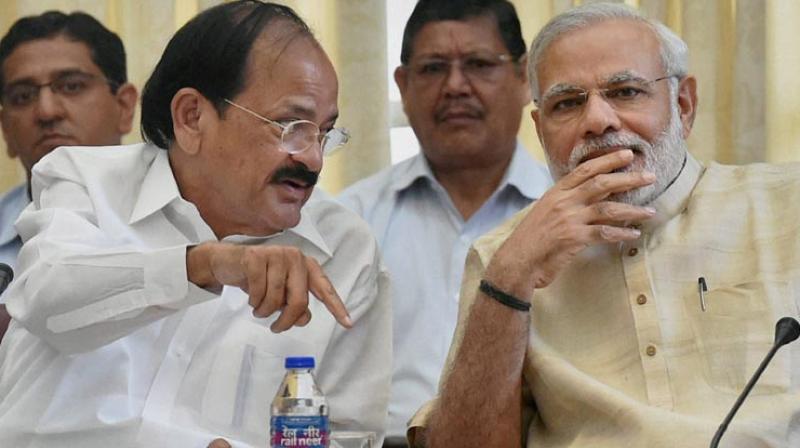 Venkaiah Naidu with PM Narendra Modi. (Photo: PTI) Venkaiah Naidu with PM Narendra Modi. (Photo: PTI)