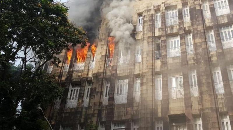 The blaze started on the third floor of the I-T office located in multi-storeyed Scindia House. (Photo: Twitter/ANI) The blaze started on the third floor of the I-T office located in multi-storeyed Scindia House. (Photo: Twitter/ANI)