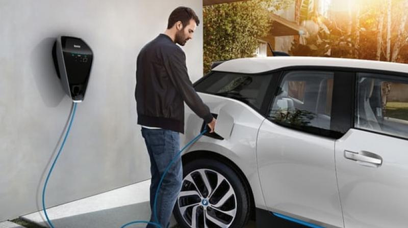 The BMW i3 being charged up using the new smart charging system(Credit: BMW) The BMW i3 being charged up using the new smart charging system(Credit: BMW)