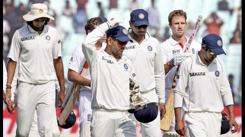 MS Dhoni leads his teammates Yuvraj Singh ,Gautam Gambhir and Ishant Sharma off the field after losing the 3rd Test match England at Eden Garden in Kolkata. PTI Photo