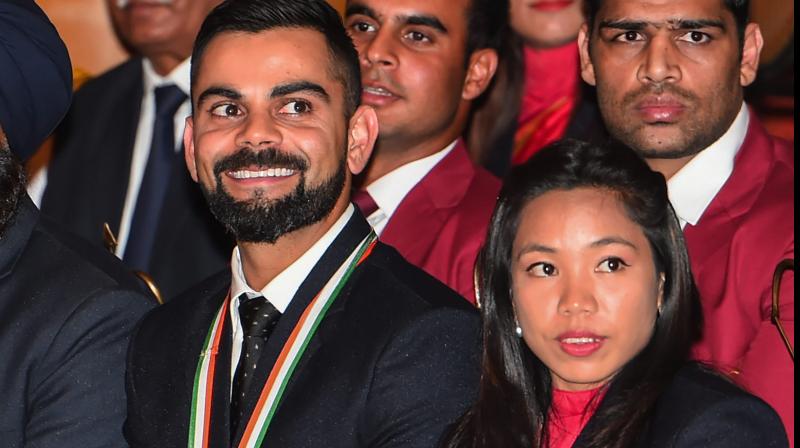 Recipients of Rajiv Gandhi Khel Ratna Award 2018 cricketer Virat Kohli and weightlifter Mirabai Chanu. PTI Photo Recipients of Rajiv Gandhi Khel Ratna Award 2018 cricketer Virat Kohli and weightlifter Mirabai Chanu. PTI Photo