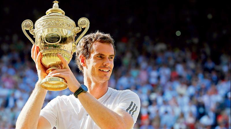 Andy Murray of Britain poses with the Wimbledon trophy he won in 2013. He defeated Novak Djokovic in the final. AP Photo Andy Murray of Britain poses with the Wimbledon trophy he won in 2013. He defeated Novak Djokovic in the final. AP Photo