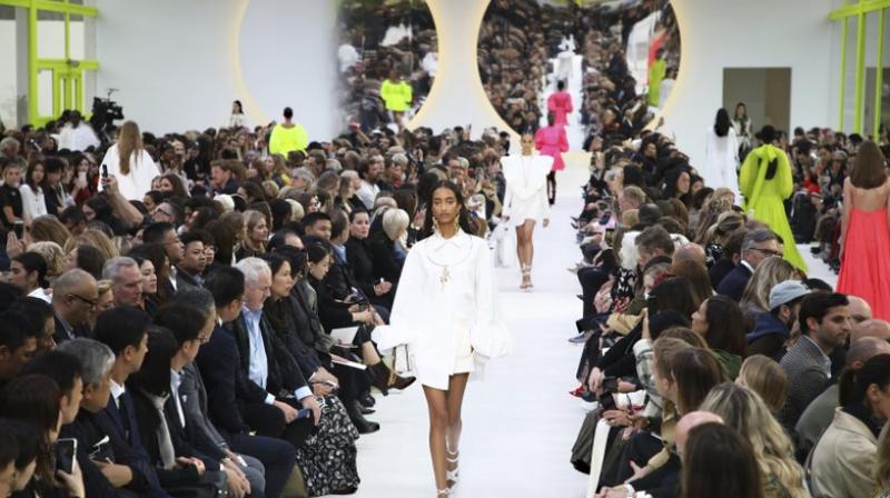 Voluminous white shirt-dresses served as a tabula rasa, a blank canvas, which Piccioli then adorned with delicate gold jewelry, such as a round necklace with a figurative bird pendant. (Photo: AP) Voluminous white shirt-dresses served as a tabula rasa, a blank canvas, which Piccioli then adorned with delicate gold jewelry, such as a round necklace with a figurative bird pendant. (Photo: AP)