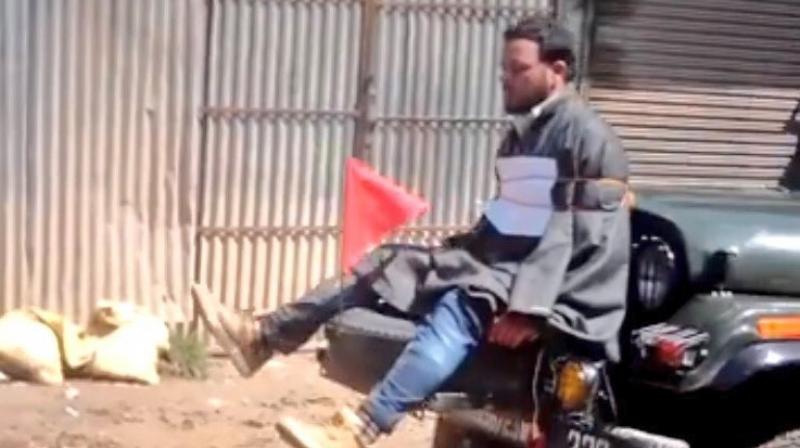 Youth tied up to an Army jeep in Jammu and Kashmir (Photo: video grab) Youth tied up to an Army jeep in Jammu and Kashmir (Photo: video grab)