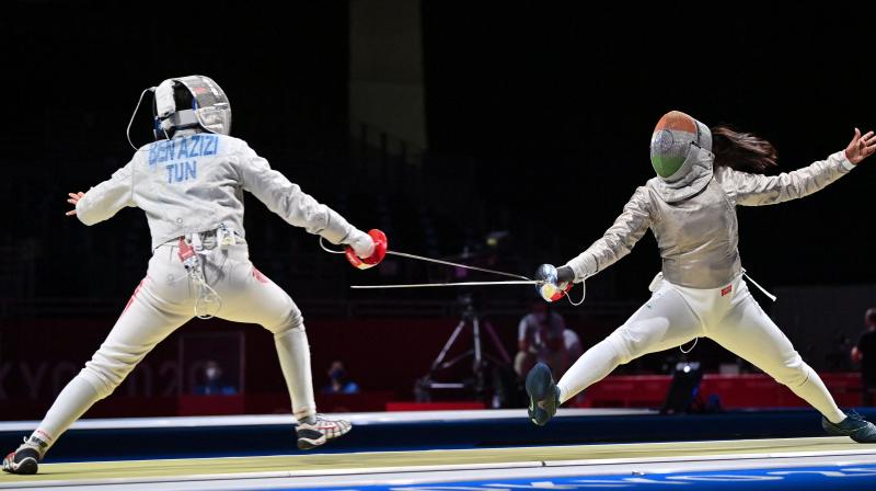 Tunisias Nadia Ben Azizi (L) compete against Indias Bhavani Devi Chadalavada Anandha Sundh in the womens individual sabre qualifying bout during the Tokyo Olympic Games at the Makuhari Messe Hall in Chiba City, Chiba Prefecture in Japan on Sunday. (Photo: AFP)