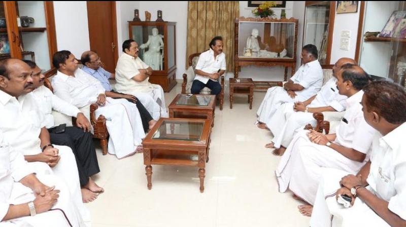 Deputy CM O Panneerselvam along with other ministers met DMK’s MK Stalin to inquire about DMK chief M Karunanidhi’s health at his residence in Chennai. (Photo: ANI/Twitter) Deputy CM O Panneerselvam along with other ministers met DMK’s MK Stalin to inquire about DMK chief M Karunanidhi’s health at his residence in Chennai. (Photo: ANI/Twitter)