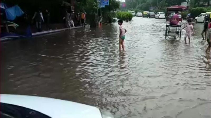 Water-logging near Delhi's Ramlila Ground following heavy rainfall in the city. (Photo: ANI/Twitter) Water-logging near Delhi's Ramlila Ground following heavy rainfall in the city. (Photo: ANI/Twitter)