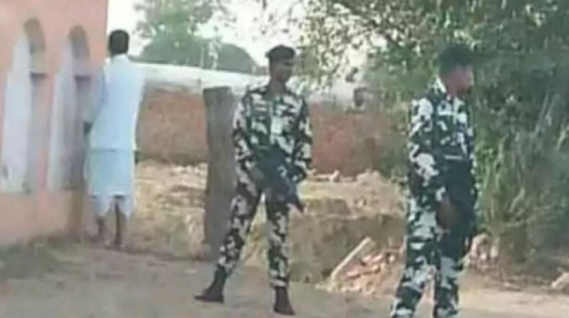 In the picture, Singh is seen urinating against the wall of a building as his security officers stand guard. (Photo: ANI/Twitter) In the picture, Singh is seen urinating against the wall of a building as his security officers stand guard. (Photo: ANI/Twitter)