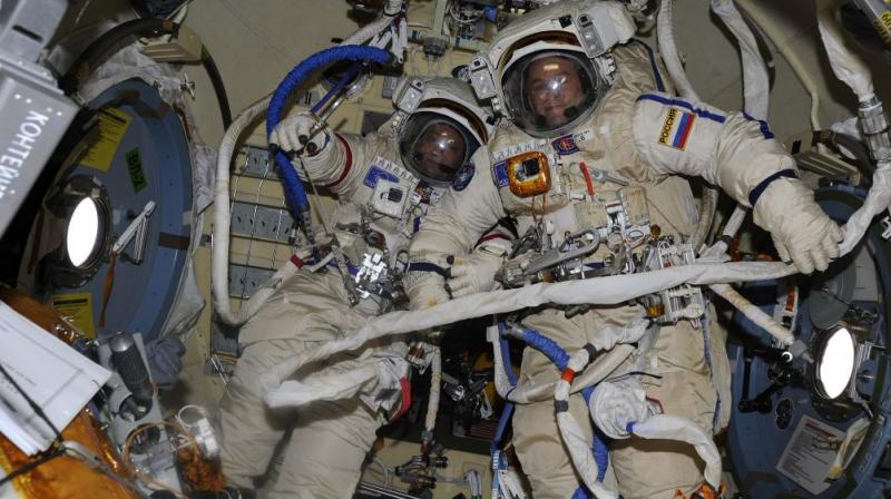 Cosmonauts Fyodor Yurchikhin (left) and Sergey Ryazanskiy are pictured in the Orlan spacesuits they are wearing during today’s spacewalk. Credit: @SergeyISS Cosmonauts Fyodor Yurchikhin (left) and Sergey Ryazanskiy are pictured in the Orlan spacesuits they are wearing during today’s spacewalk. Credit: @SergeyISS
