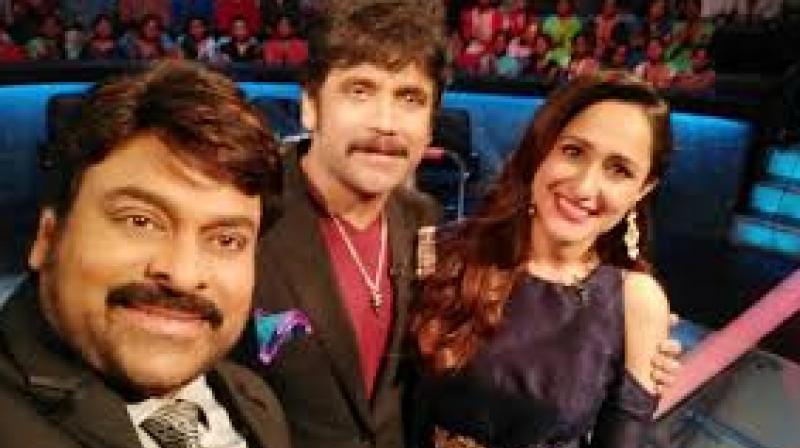Pragya Jaiswal with Chiranjeevi and Nagarjuna. Pragya Jaiswal with Chiranjeevi and Nagarjuna.
