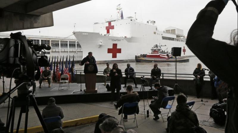 A naval hospital ship with a 1,000 bed-capacity, Monday, March 30, 2020, at Pier 90 in New York. The ship will be used to treat patients who do not have the new coronavirus as land-based hospitals fill up to capacity with those that do. (AP Photo)