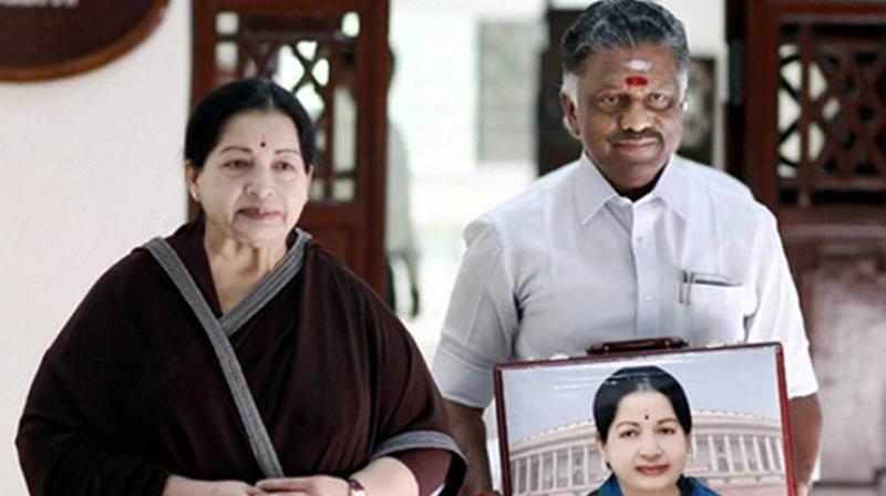 Tamil Nadu caretaker Chief Minister O. Panneerselvam with late CM J. Jayalalithaa (Photo: PTI/File) Tamil Nadu caretaker Chief Minister O. Panneerselvam with late CM J. Jayalalithaa (Photo: PTI/File)