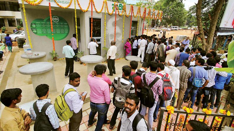 People rush to take food at Indira canteen at Bannappa Park, in Bengaluru on Friday. (Photo: DC) People rush to take food at Indira canteen at Bannappa Park, in Bengaluru on Friday. (Photo: DC)