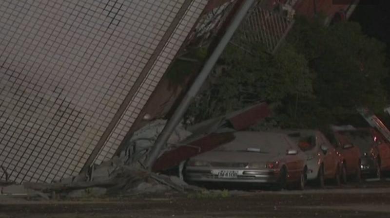 The worst-hit Marshal Hotel partly crumpled into the ground, leaving it slanting on its side, as rescuers on cranes attempted to free people from its upper floors. (Photo: ANI) The worst-hit Marshal Hotel partly crumpled into the ground, leaving it slanting on its side, as rescuers on cranes attempted to free people from its upper floors. (Photo: ANI)