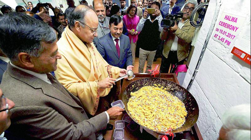 Union finance minister Arun Jaitley taking part in the ‘Halwa Ceremony’ to mark the beginning of printing of budgetary documents, in New Delhi on Thursday. (Photo: PTI) Union finance minister Arun Jaitley taking part in the ‘Halwa Ceremony’ to mark the beginning of printing of budgetary documents, in New Delhi on Thursday. (Photo: PTI)