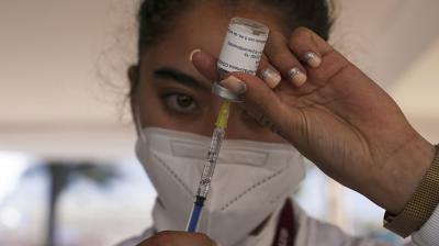 A nurse a dose of the booster against COVID-19 during a vaccination campaign for people 60 and over, in Mexico City. (Photo: AP)