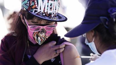 A youth gets a shot of a COVID-19 vaccine at the vaccination center in La Paz, Bolivia. (Photo: AP)