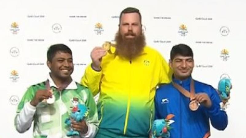 Mitharval conceded the lead in the following round with a 7.2 and 7.6, going down from gold to silver and finally settling for bronze. (Photo: Twitter / IOA) Mitharval conceded the lead in the following round with a 7.2 and 7.6, going down from gold to silver and finally settling for bronze. (Photo: Twitter / IOA)