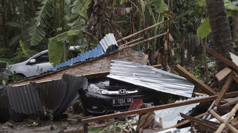 Images showed wave pushed tangled mess of corrugated steel roofing, timber, rubble and flotsam inland from coast at Carita beach and at other places it uprooted trees and left trail of debris strewn across ground., (Photo: AP) Images showed wave pushed tangled mess of corrugated steel roofing, timber, rubble and flotsam inland from coast at Carita beach and at other places it uprooted trees and left trail of debris strewn across ground., (Photo: AP)