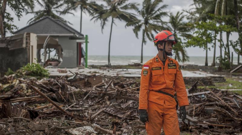 A rescuer stands amid debris at a tsunami-ravaged area in Carita, Indonesia, Sunday. (Photo: AP) A rescuer stands amid debris at a tsunami-ravaged area in Carita, Indonesia, Sunday. (Photo: AP)
