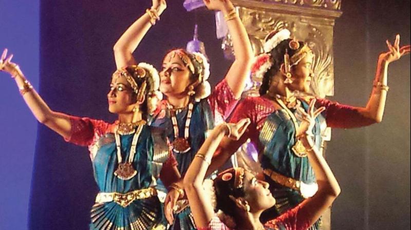 The dancer draws the vaahana or the vehicle of a god using only their feet to move about the rangoli colours on the stage. The dancer draws the vaahana or the vehicle of a god using only their feet to move about the rangoli colours on the stage.
