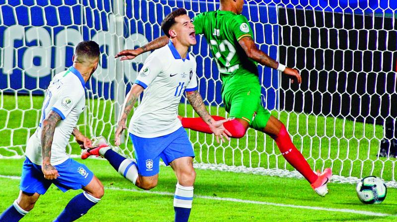 Brazil’s Philippe Coutinho (right) celebrates after scoring against Bolivia during their Copa America football tournament group match at the Cicero Pompeu de Toledo Stadium in Sao Paulo, Brazil on Saturday. (Photo: AFP) Brazil’s Philippe Coutinho (right) celebrates after scoring against Bolivia during their Copa America football tournament group match at the Cicero Pompeu de Toledo Stadium in Sao Paulo, Brazil on Saturday. (Photo: AFP)