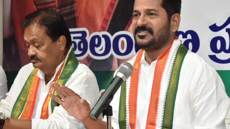 Telangana Congress working president A. Revanth Reddy speaks at a press conference at Gandhi Bhavan in Hyderabad on Friday.