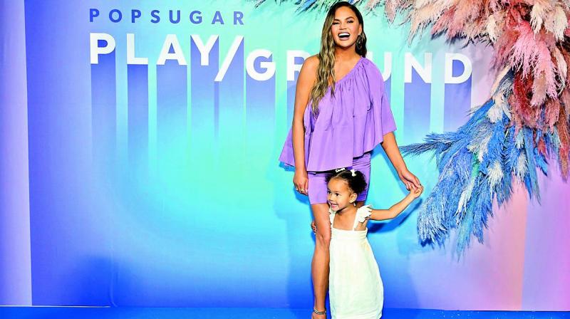 American model and author Chrissy Teigen tagged her toddler with her to the Popsugar Play/Ground event on Sunday afternoon. American model and author Chrissy Teigen tagged her toddler with her to the Popsugar Play/Ground event on Sunday afternoon.