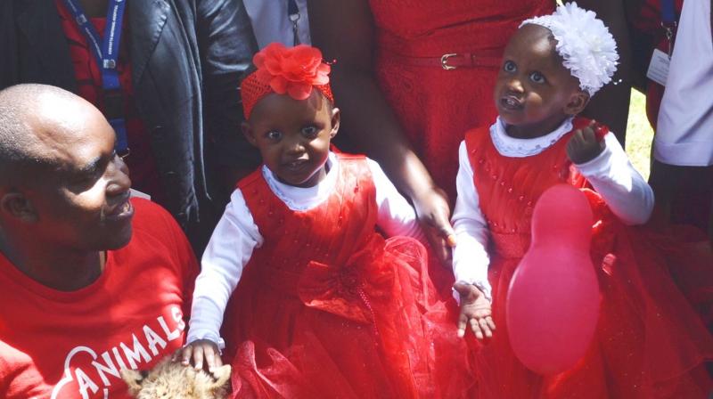 Former conjoined twins Blessing and Favor all pretty in red.(Photo: Facebook / Kenyatta National Hospital) Former conjoined twins Blessing and Favor all pretty in red.(Photo: Facebook / Kenyatta National Hospital)