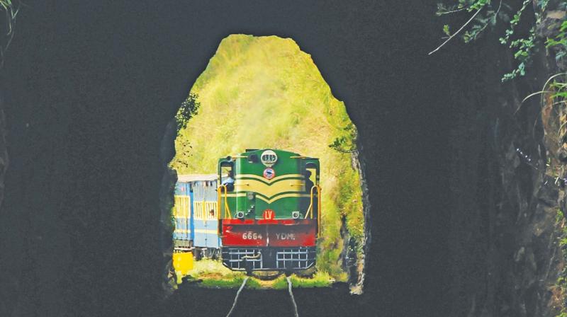 Photo shows the Ooty hill train entering a tunnel along the Ooty-Coonoor sector of the NMR track. (Photo: M.Prabhu) Photo shows the Ooty hill train entering a tunnel along the Ooty-Coonoor sector of the NMR track. (Photo: M.Prabhu)